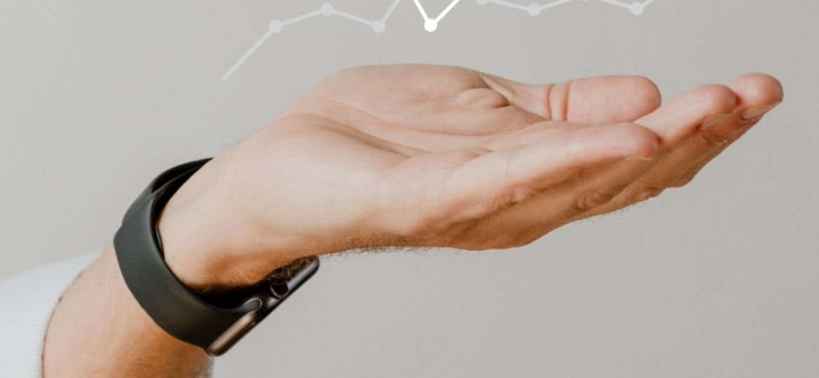 Presenting arm isolated on beige